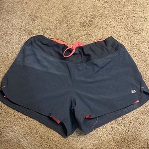 Gray athletic shorts with hot pink undershorts